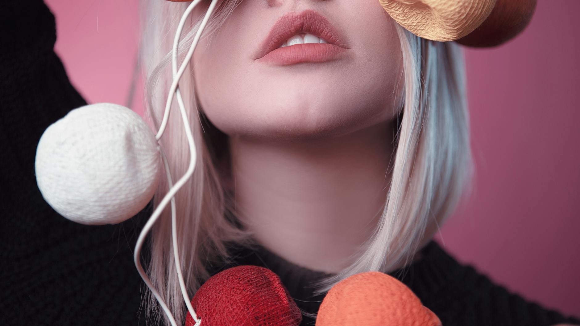 woman holding knitted ball decor